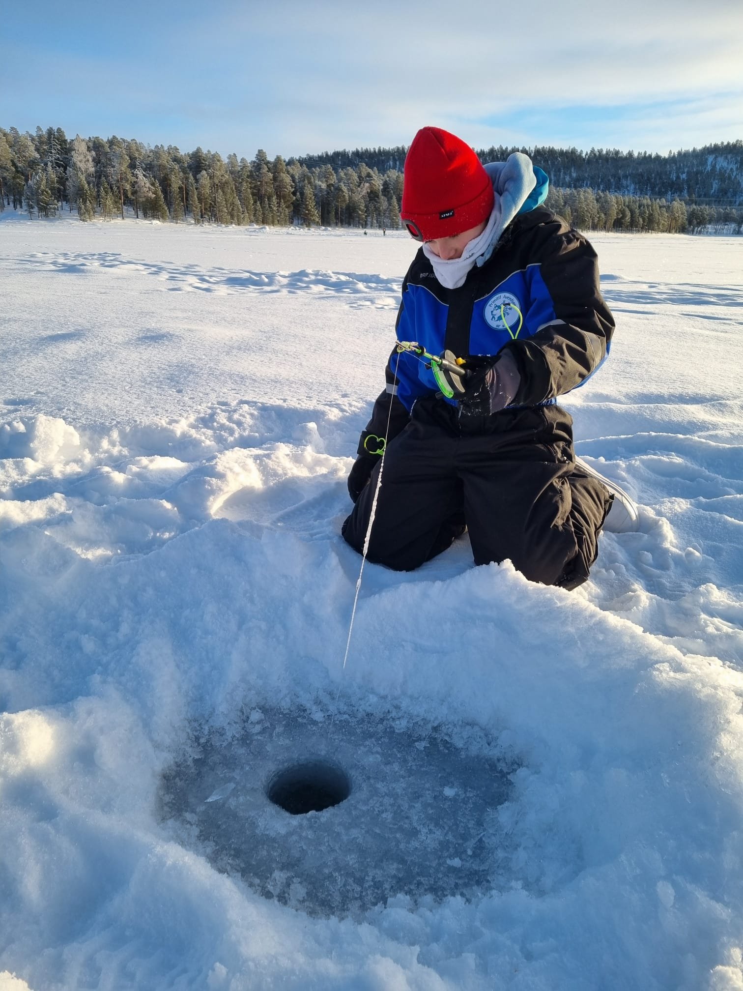 Estadia em família na Lapónia finlandesa - Raquetes & pesca no gelo - Foto do dia